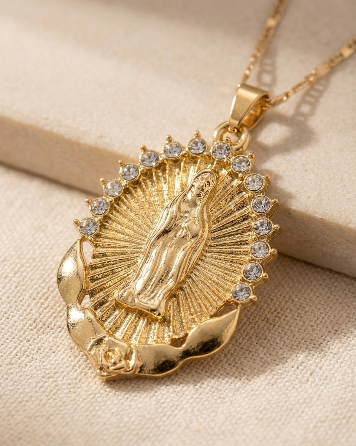 The Radiant Madonna medal held in the hand, true to size [c:gold]