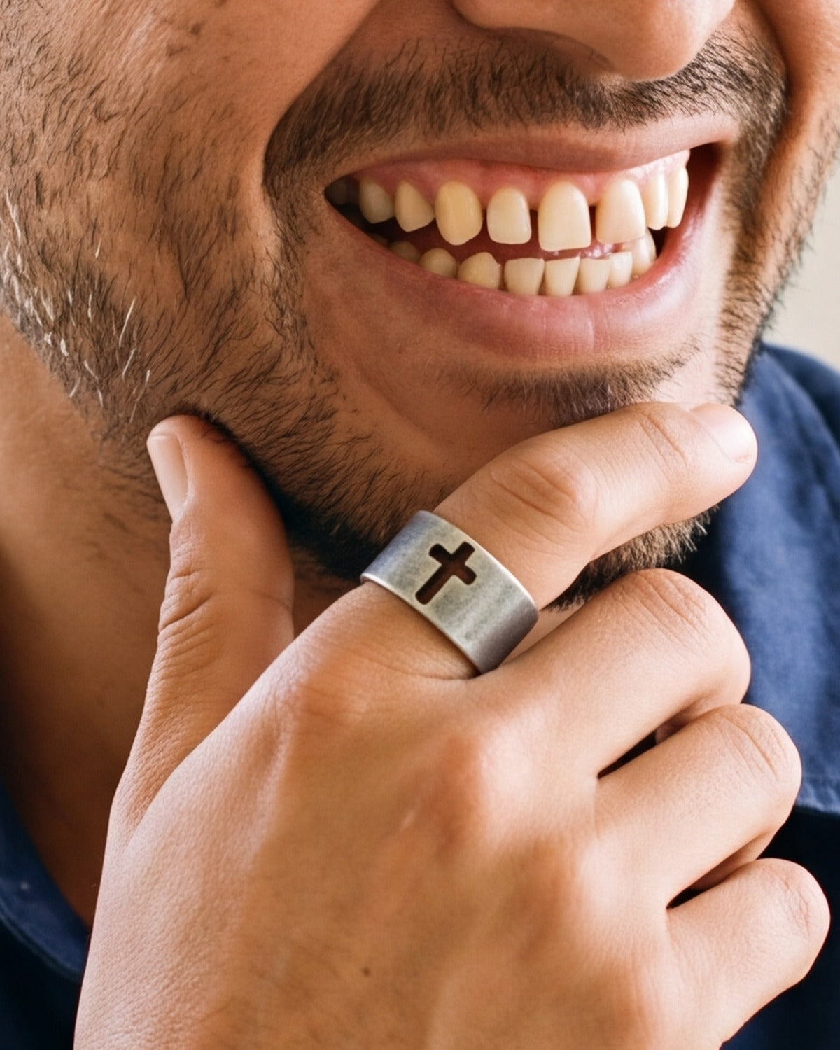The Retro Cross ring worn by a man, hand close-up, true to size