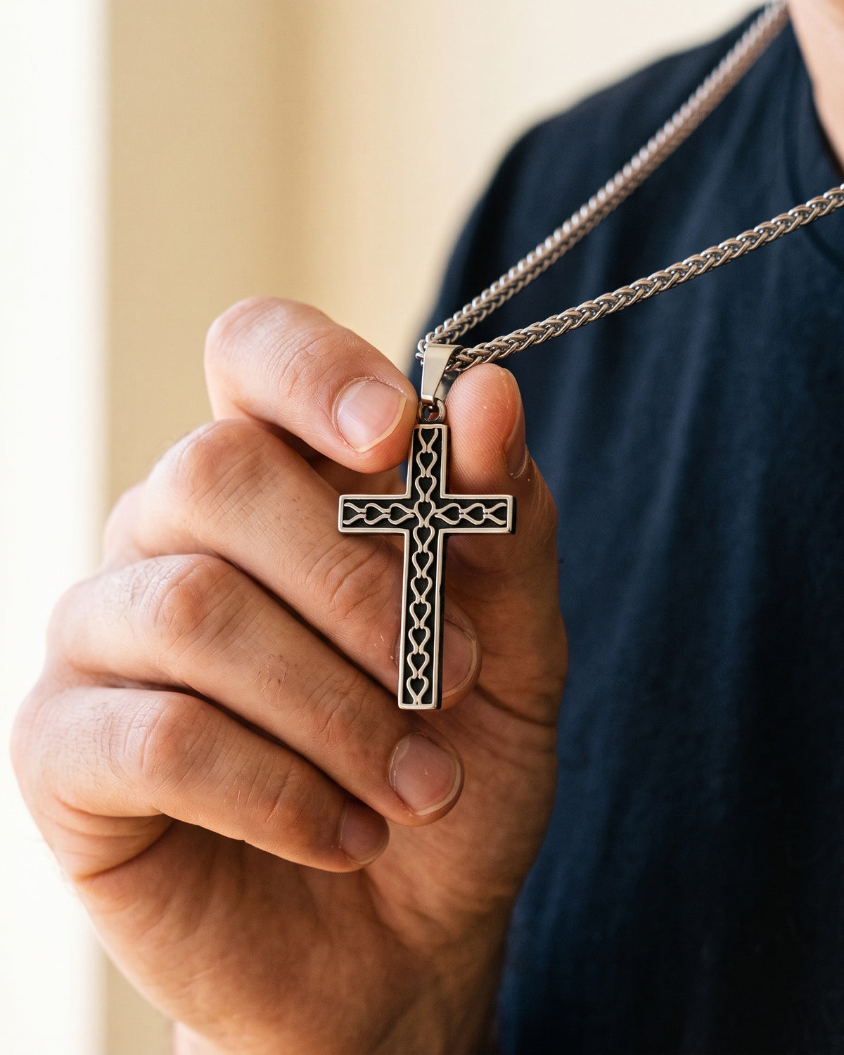The Reverent Heart Cross held in the hand, true to size [c:silver]