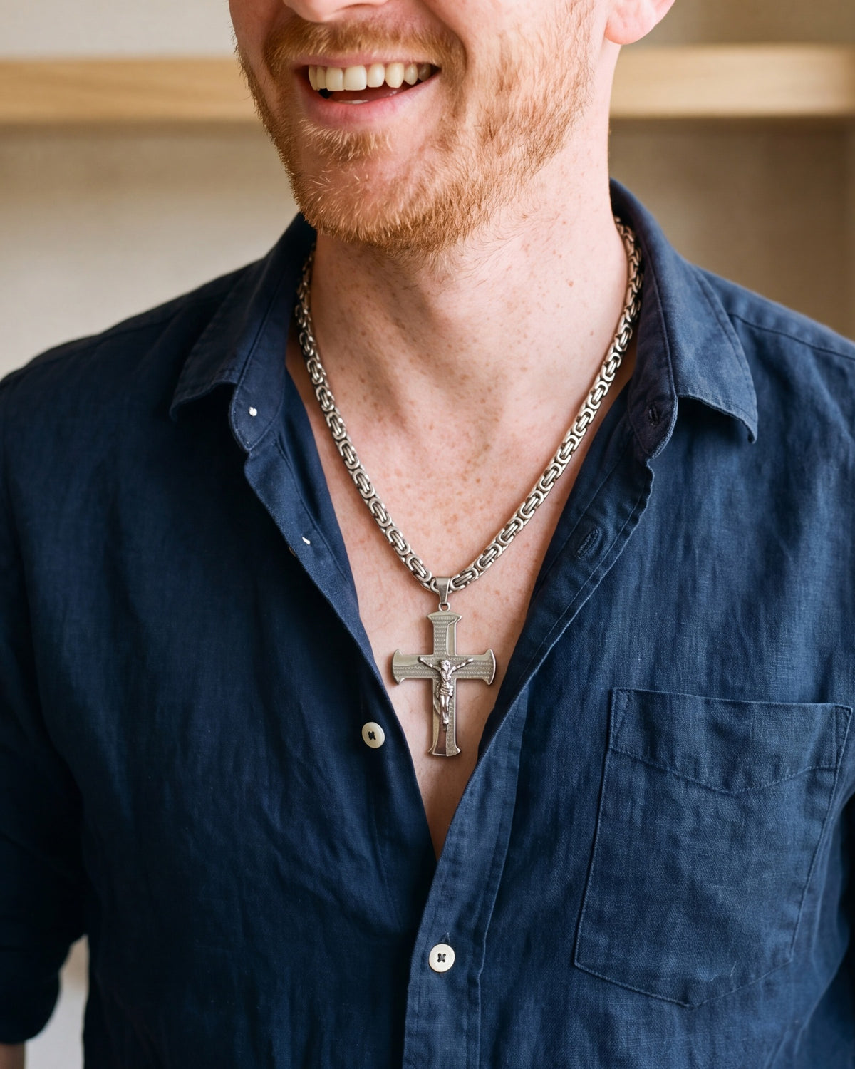 The silver Reverent Prayer worn by a man, close-up, true to size [c:silver]