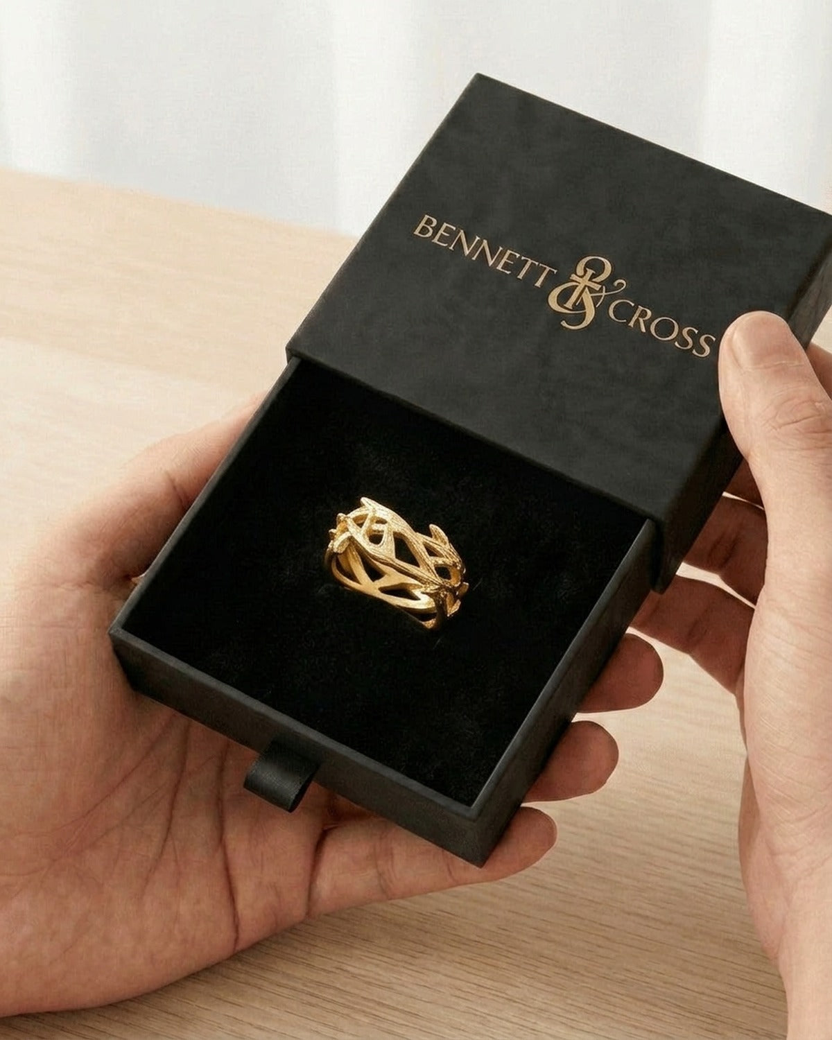 The Reverent Weave in its black Bennett & Cross gift box