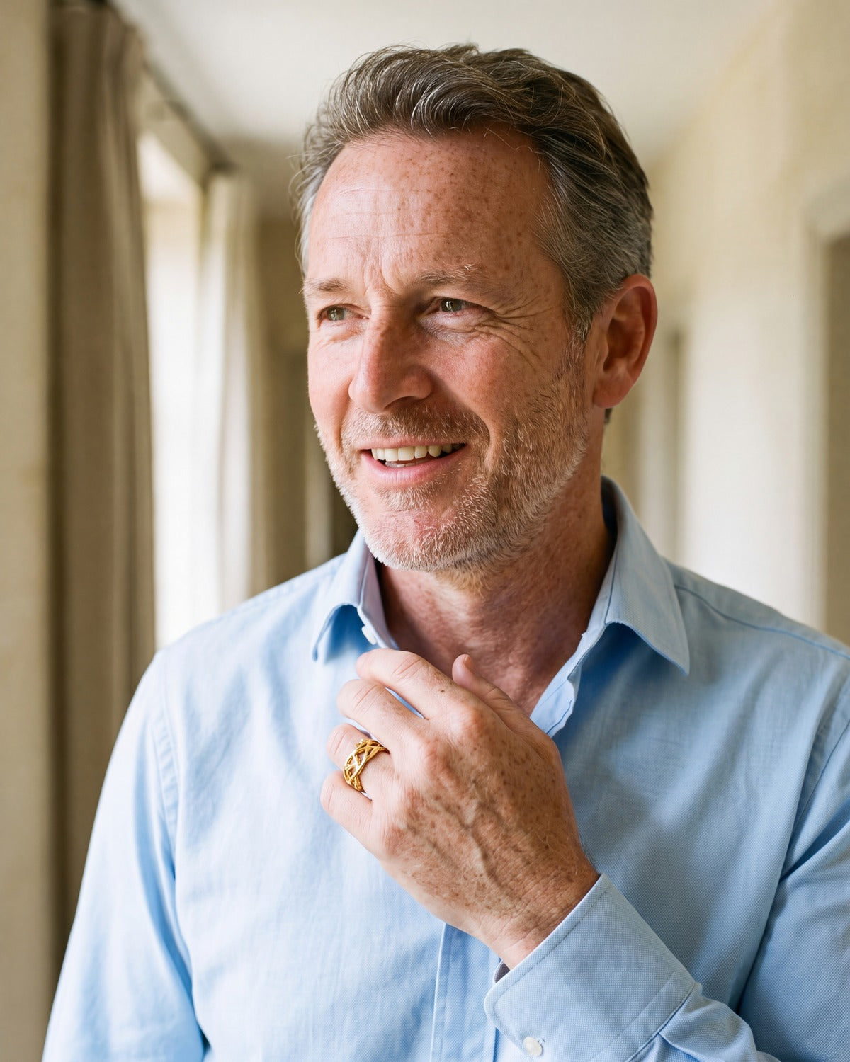 Smiling man wearing The Reverent Weave ring