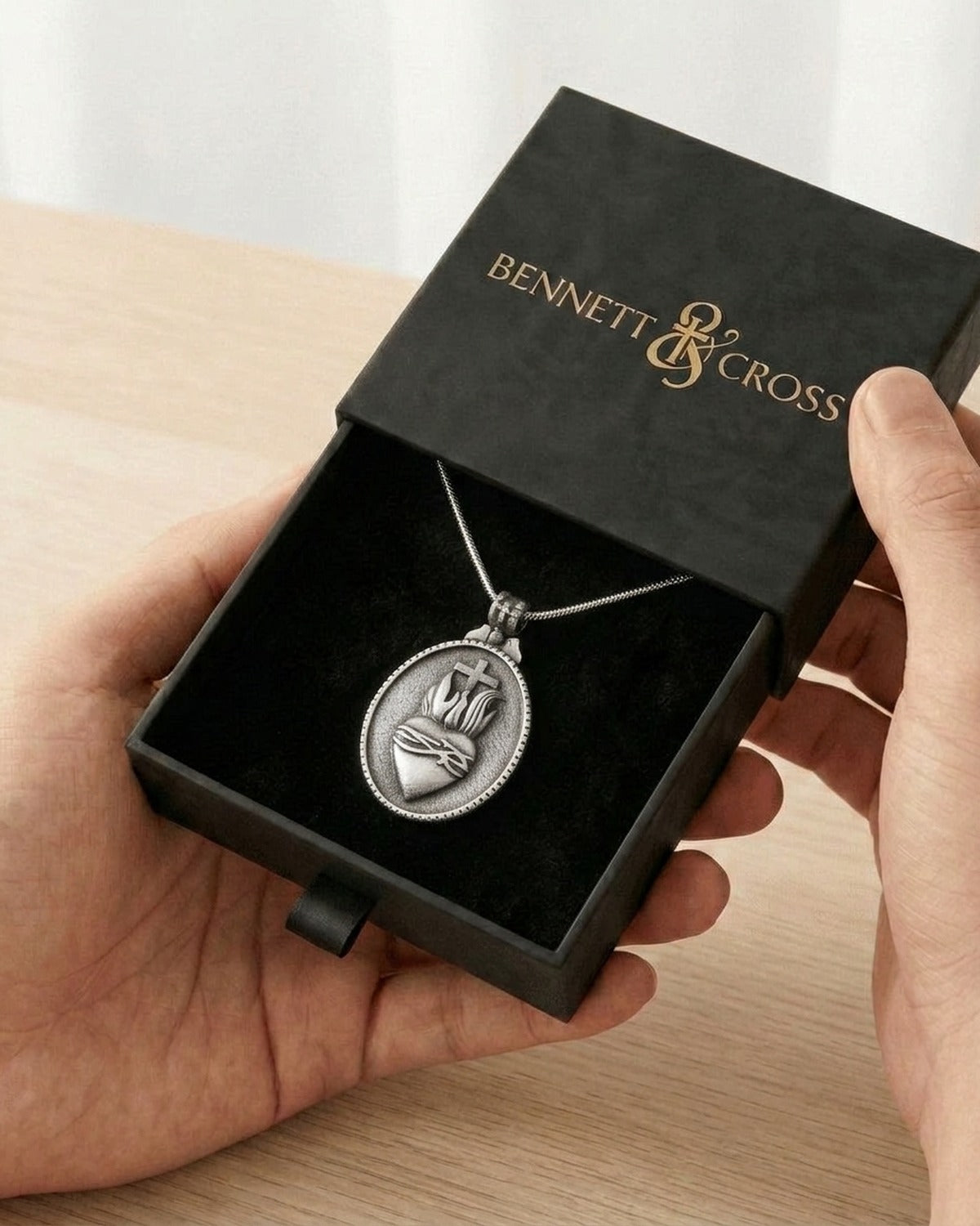 The Sacred Heart Set in its black Bennett & Cross gift box