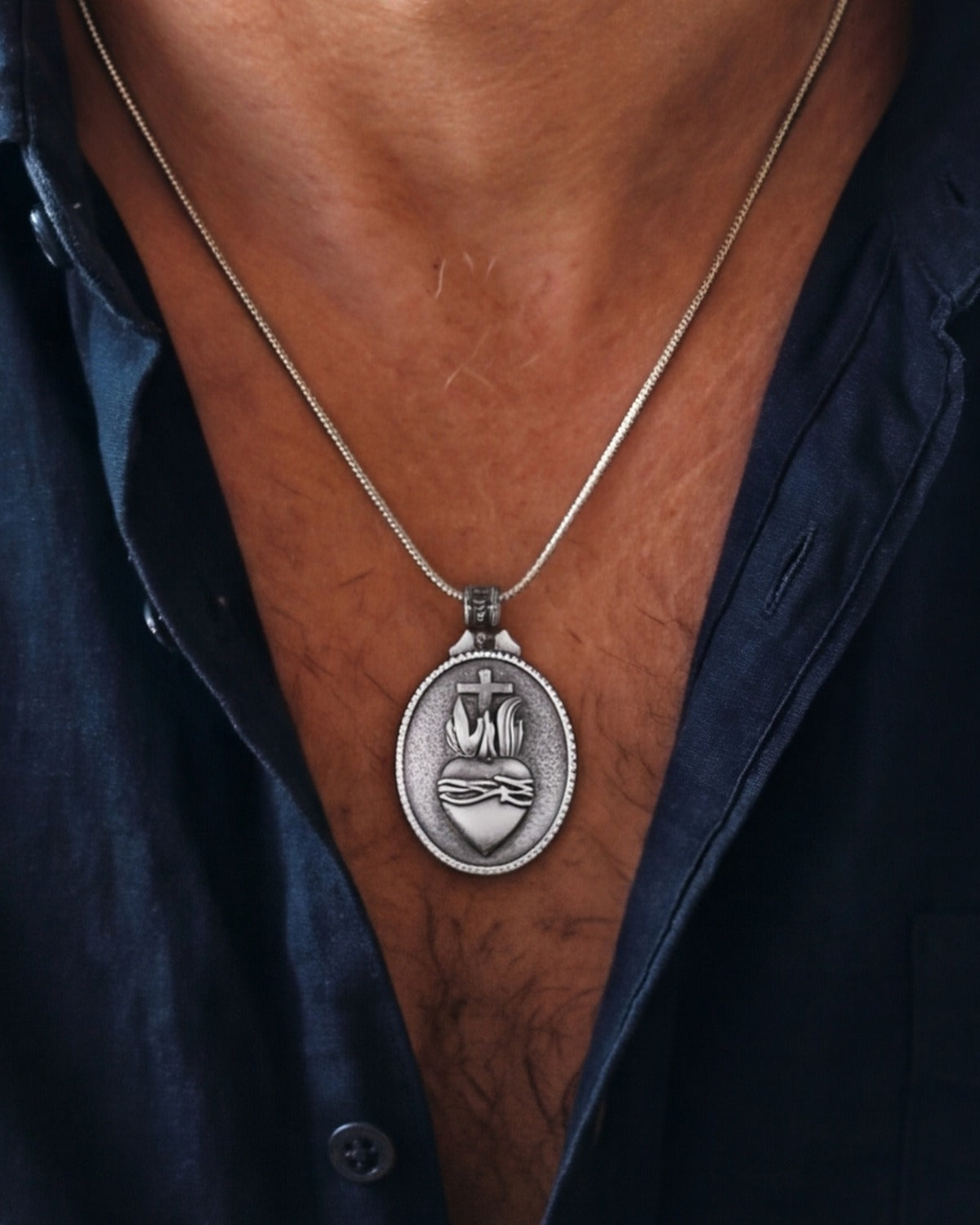 The Sacred Heart Set worn by a man, close-up, true to size [c:antique-silver]