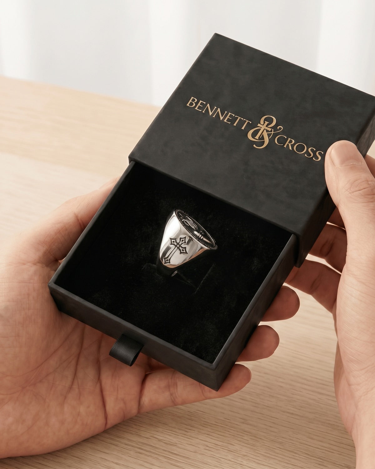The Sacred Heart Signet in its black Bennett & Cross gift box