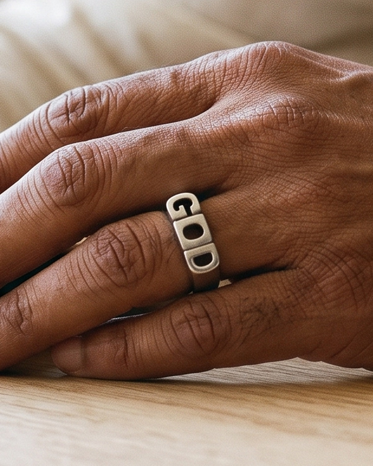 The Sacred Script on a man's finger, close-up, true to size