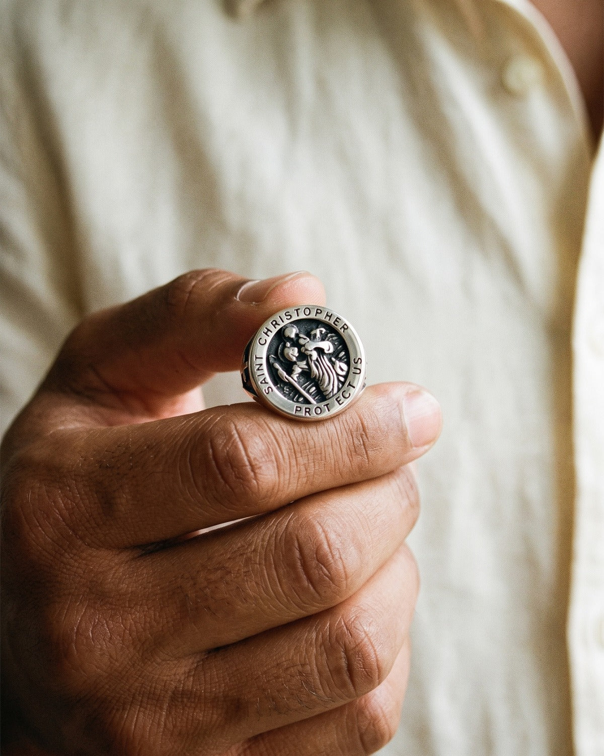 The Saint Christopher Signet held in the hand, Saint Christopher Protect Us engraving, true to size