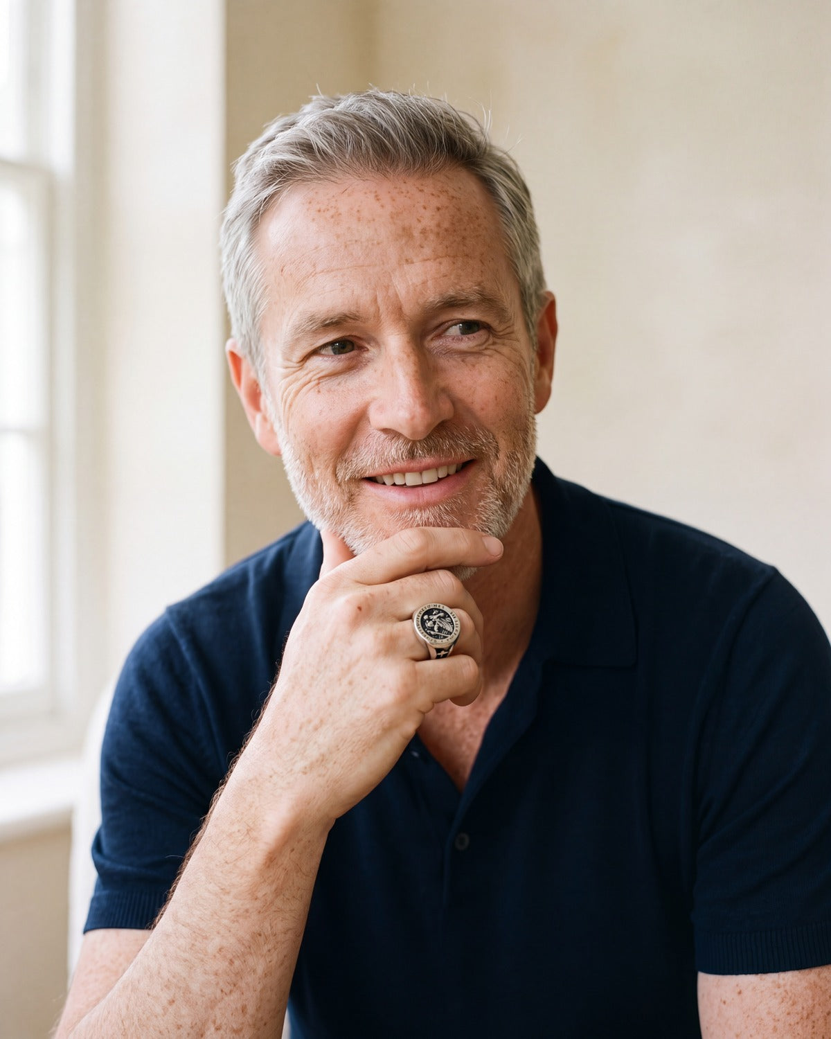 Smiling man wearing The Saint Christopher Signet ring