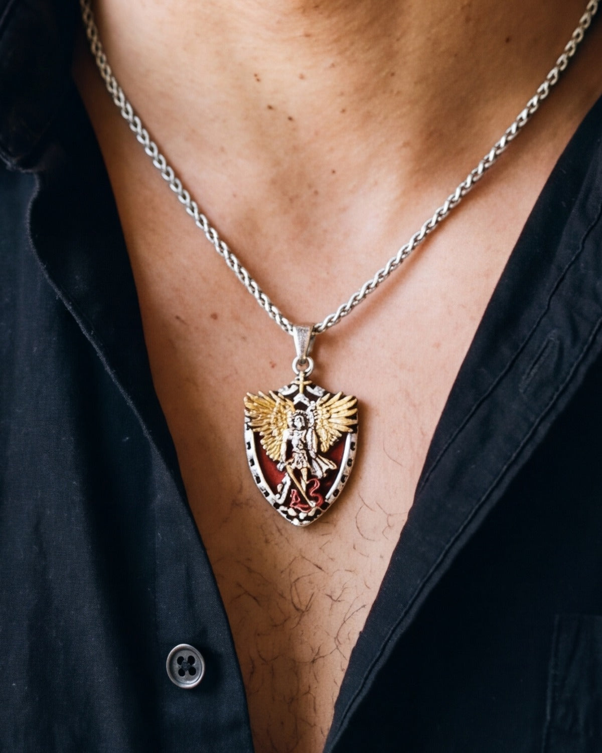 The Saint Michael Crest worn by a man, close-up, true to size [c:antique-silver]