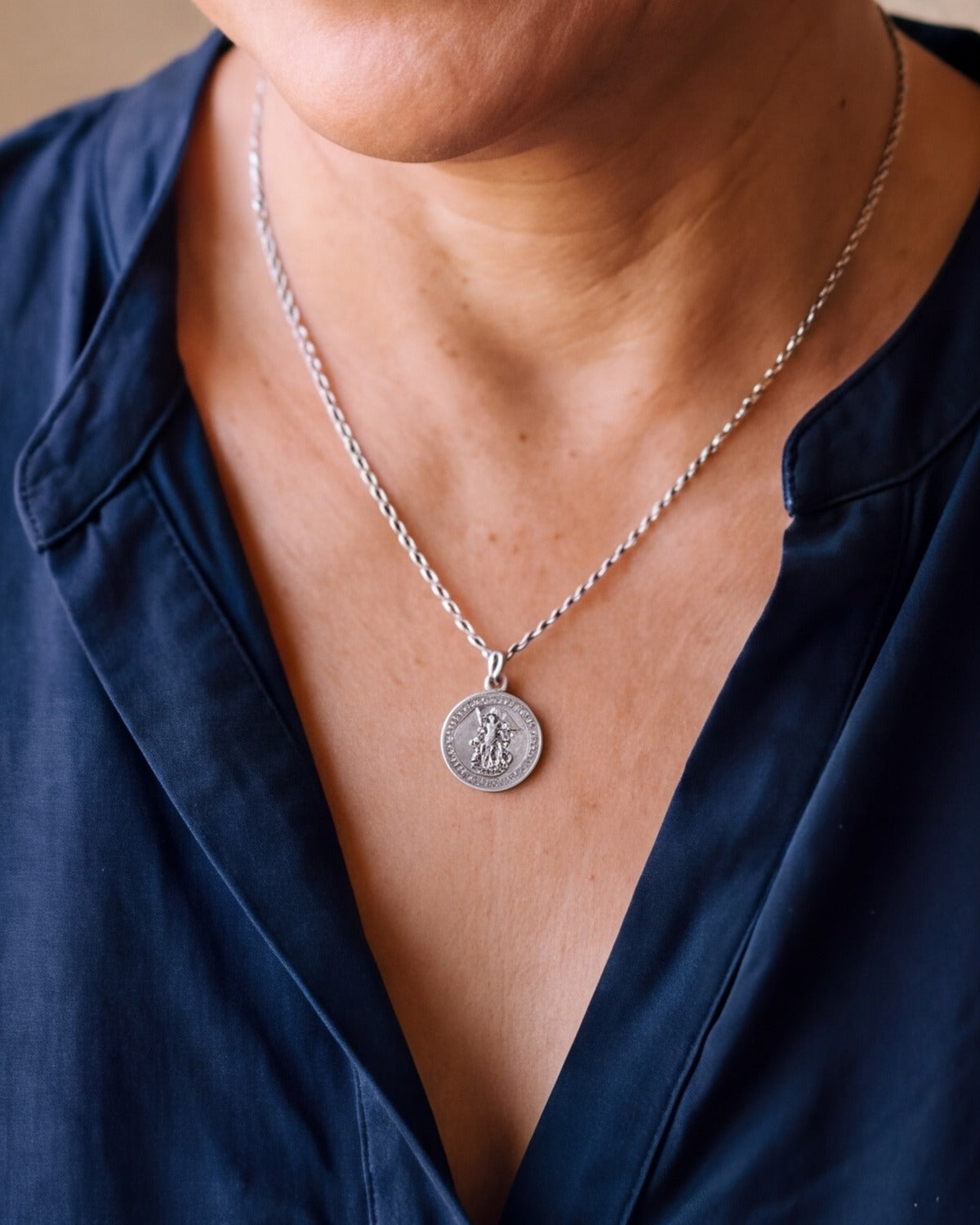 The antique silver Saint Michael Prayer worn, close-up, true to size [c:antique-silver]