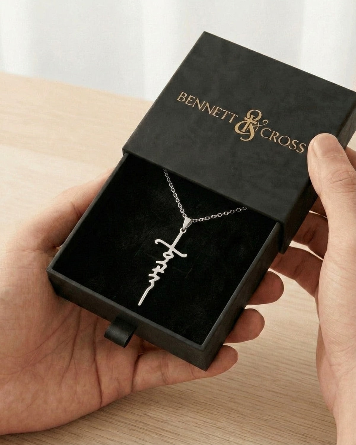 The Scripted Cross in its black Bennett & Cross gift box
