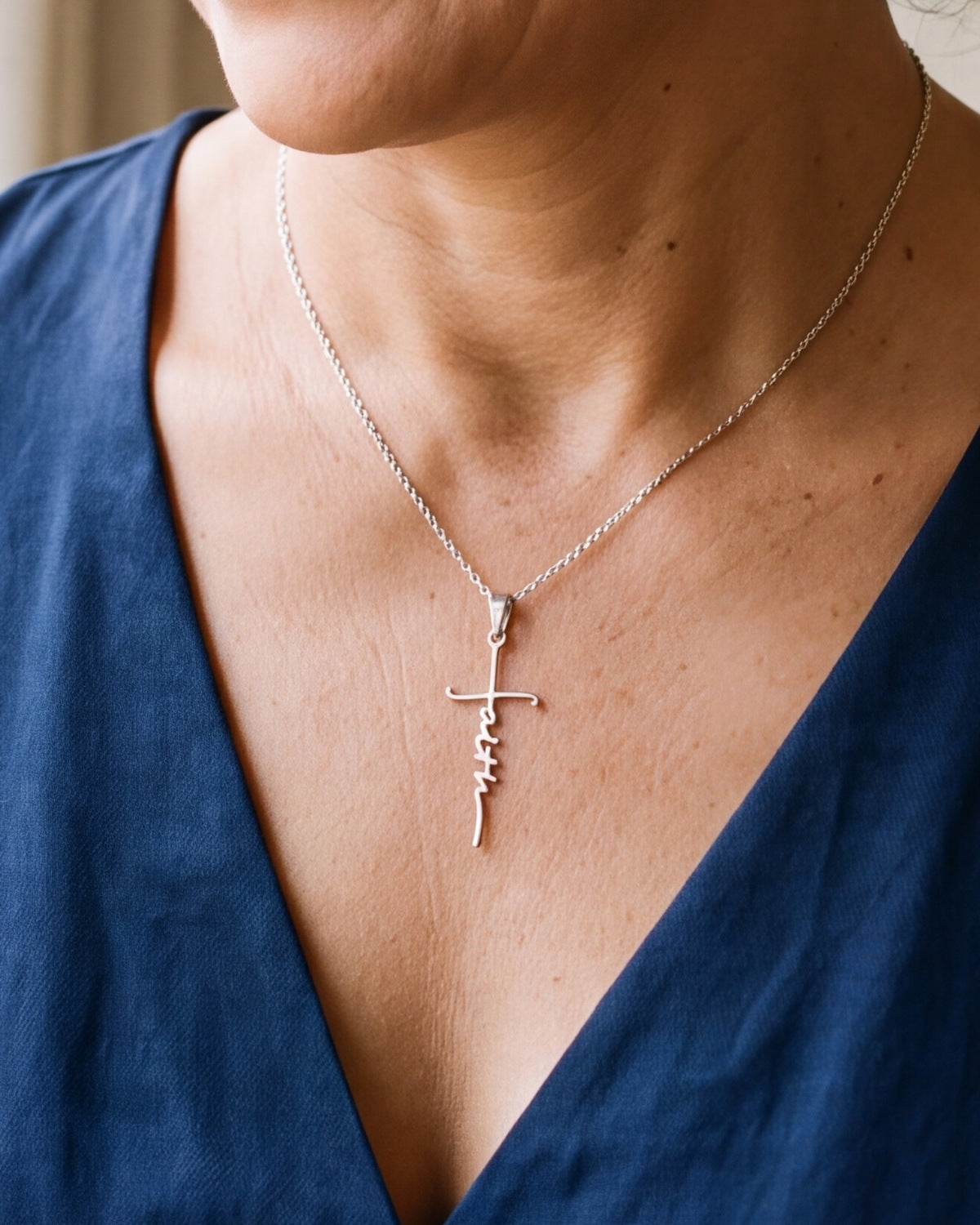 The Scripted Faith worn on the chest, close-up, true to size [c:silver]