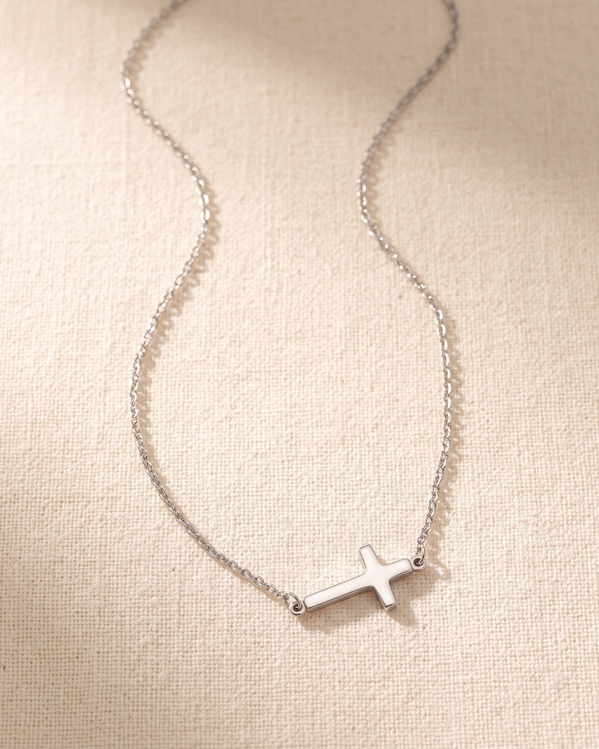 The Sideways Cross necklace laid flat [c:silver]