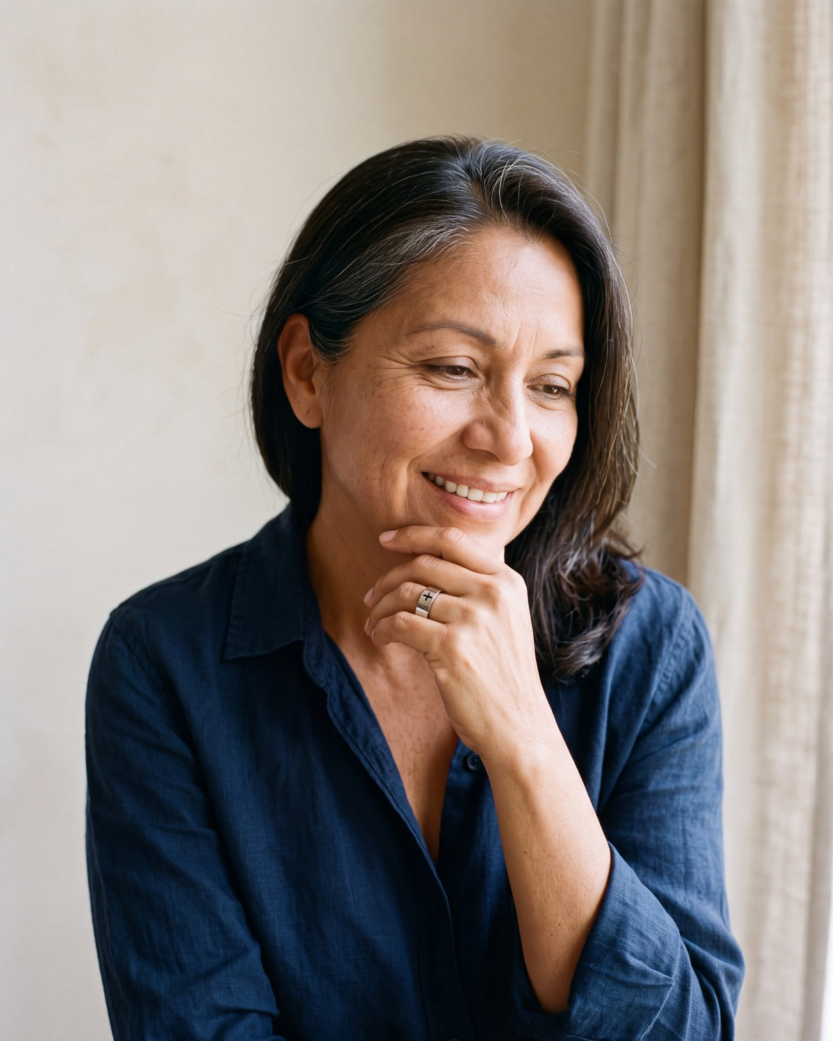 Smiling woman wearing The Steadfast Band ring
