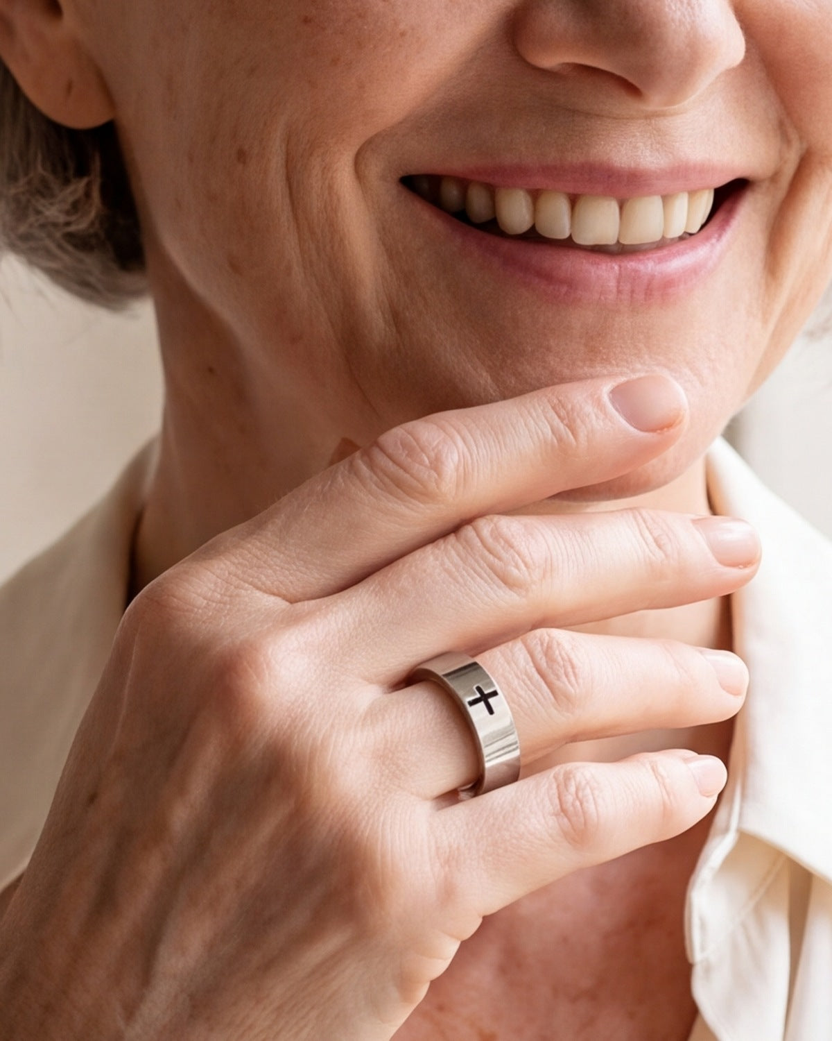 The Steadfast Bond on a woman's finger, close-up, true to size