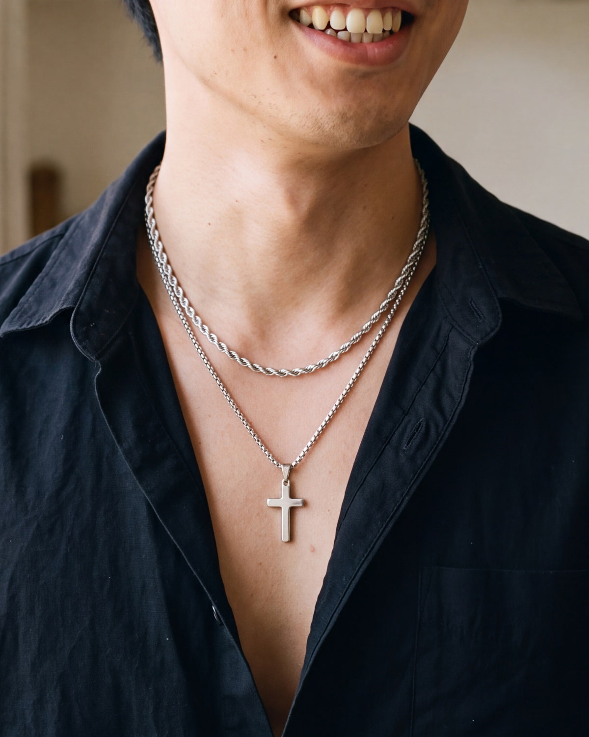 The Steadfast Cross double chain worn by a man, close-up, true to size [c:silver]