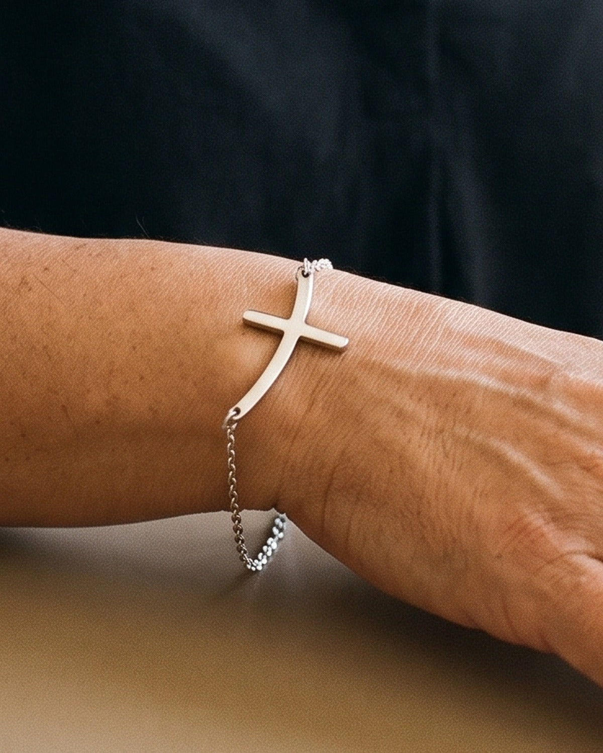The Subtle Cross worn by a woman, close-up, true to size [c:silver]