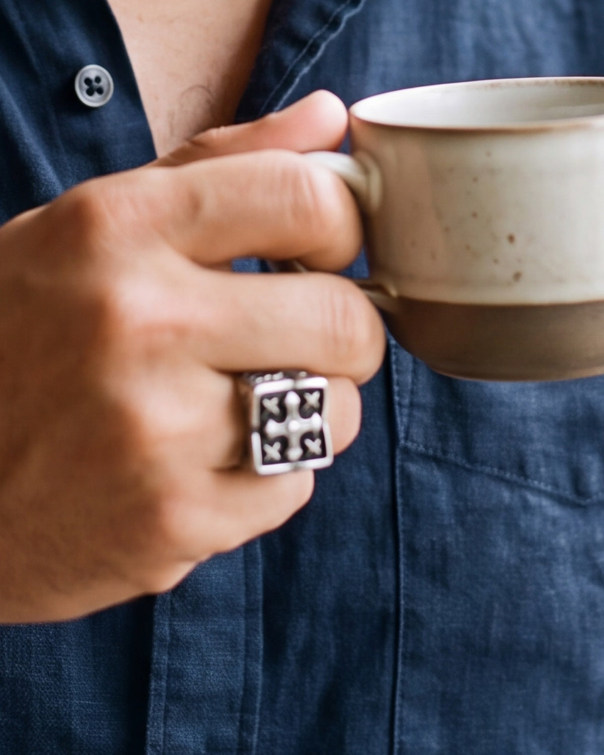 The Templar Signet on a man's finger, close-up, true to size