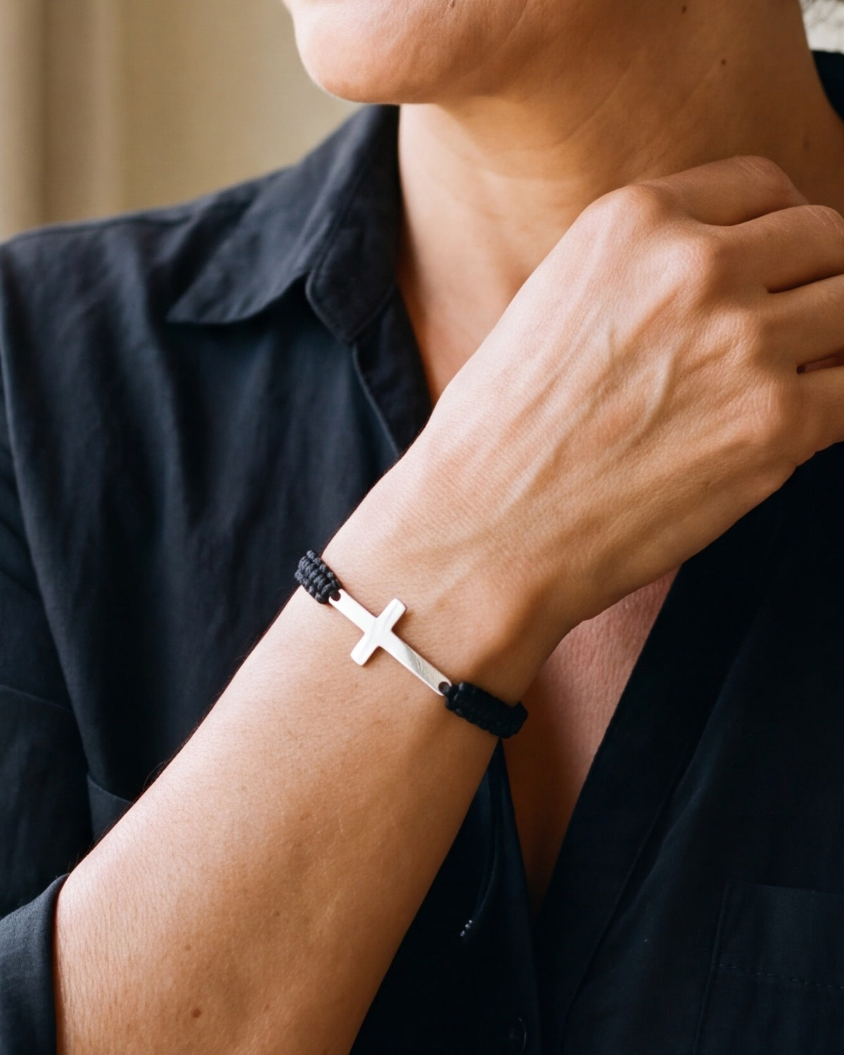 The Woven Devotion on a woman's wrist, close-up, true to size [c:black]