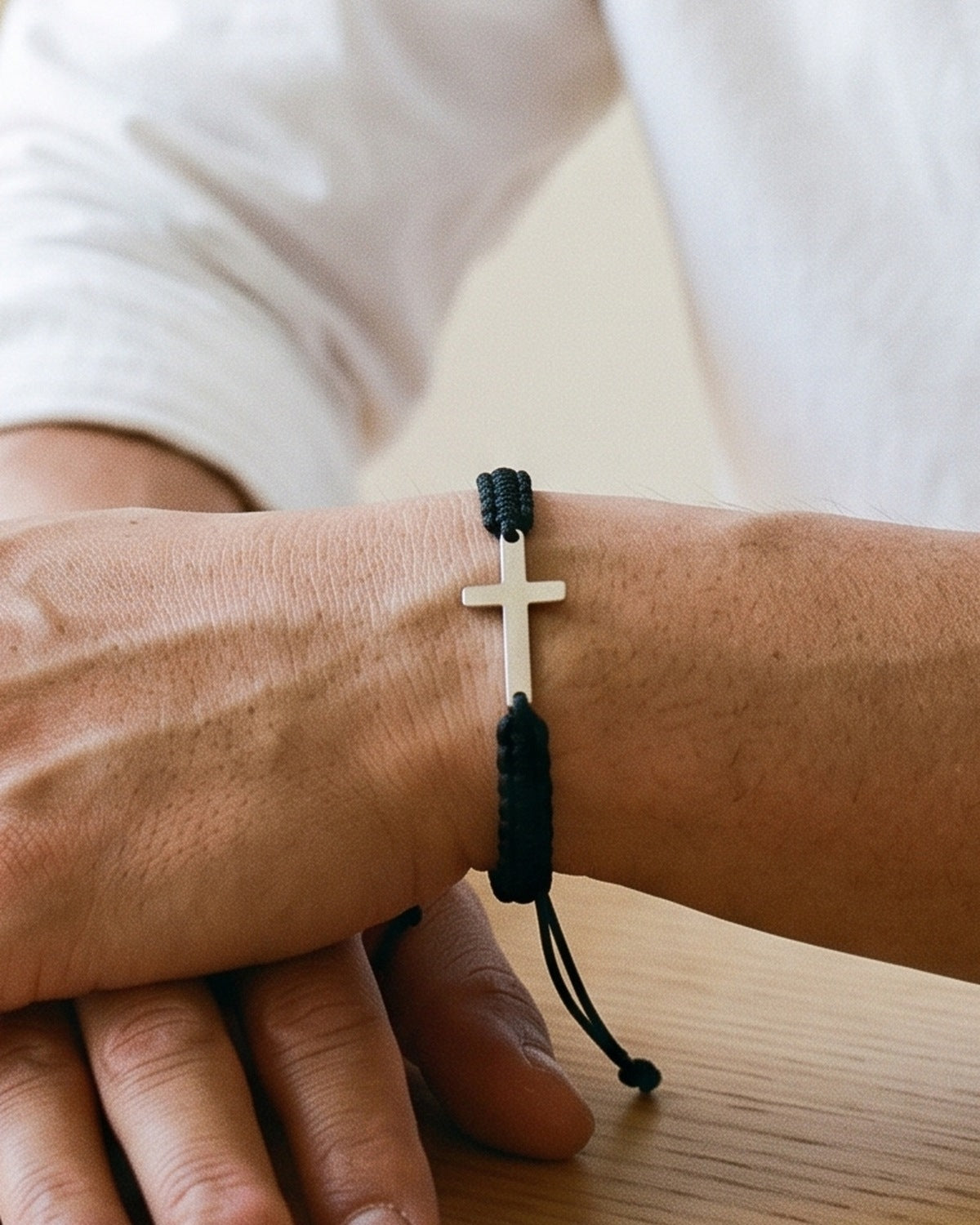 The Woven Devotion on a man's wrist, close-up, true to size [c:black]