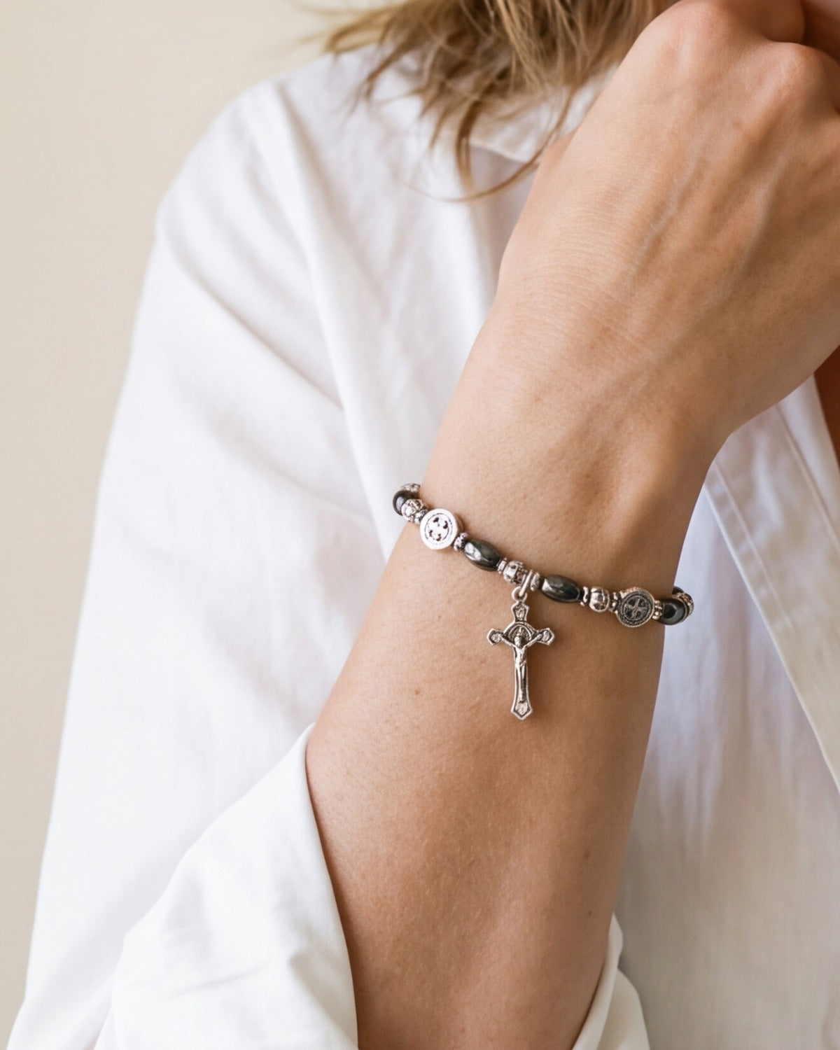 The Wrist Decade on a woman's wrist, close-up, true to size [c:saint-benedict-shield]