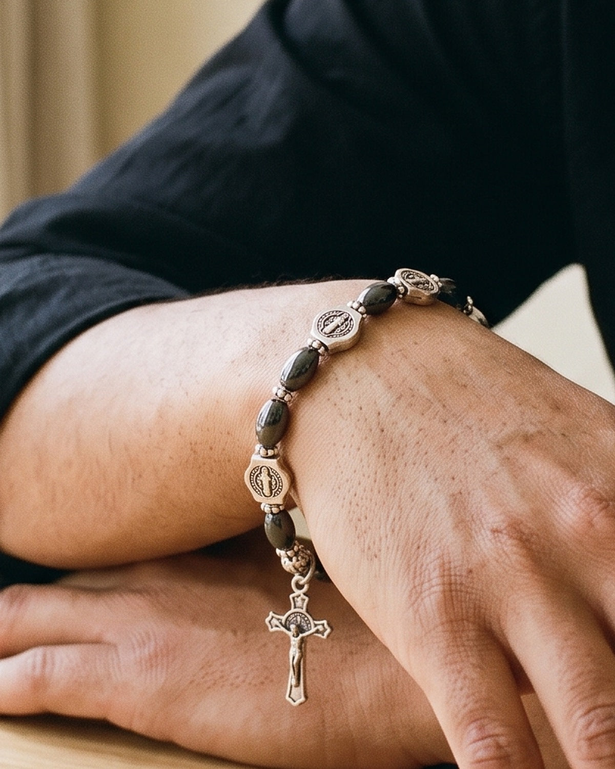 The Wrist Decade on a man's wrist, close-up, true to size [c:saint-benedict-shield]
